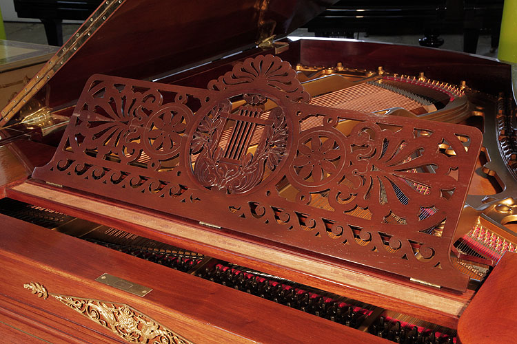 Ibach openwork music desk is carved with stylised palmettes, waves and flowers with a central lyre surrounded by laurel leaves