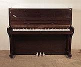 Piano for sale. A 2001, Pearl River upright piano with a mahogany case and polyester finish