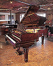 Piano for sale. An 1899, Steinway Model B grand piano for sale with a rosewood case, filigree music desk and fluted, barrel legs