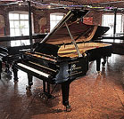 Piano for sale. A brand new, Wilh Steinberg WS-D275 concert grand piano with a black case and brass fittings.