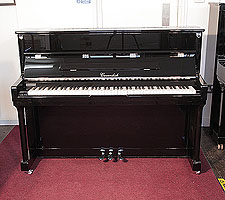Piano for sale.  Cavendish upright piano with a black case and chrome fittings 