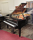 Piano for sale.  Brand new, Feurich Model F218 Concert I Grand piano for sale with a black case, cut-out music desk with LED strip and square legs with dual casters