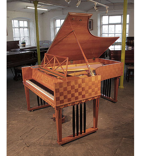 Restored, 1907 Ibach Model 2 grand piano with a cherry case in a checkerboard design. Piano has square, gate legs with four contrasting black spindles. Designed by Emanuel von Seidl. Piano one of two designed for and offered to Richard Strauss.