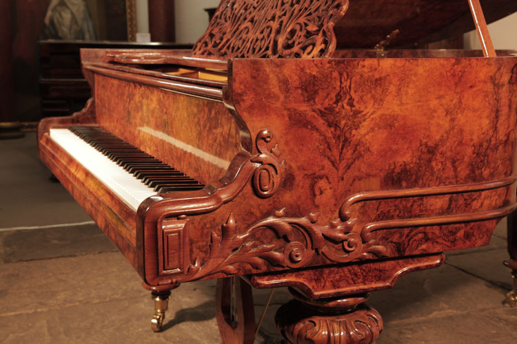 Schiedmayer serpentine piano cheek with dual case moulding that wraps around the cabinet. Piano cheek carved with acanthus, scrolls anda classical meander in high relief