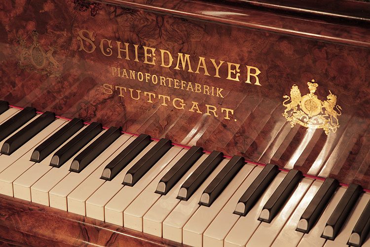 Schiedmayer piano manufacturers logo inlaid in brass on fall