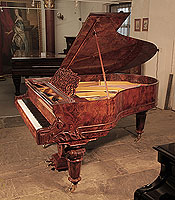 Restored, Schiedmayer grand piano for sale with a burr walnut case, filigree music desk and turned, faceted legs.