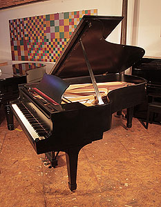 Restored 1935, Steinway Model B grand piano with a satin, black case and spade legs. Piano has a three-pedal lyre and an eighty-eight note keyboard.