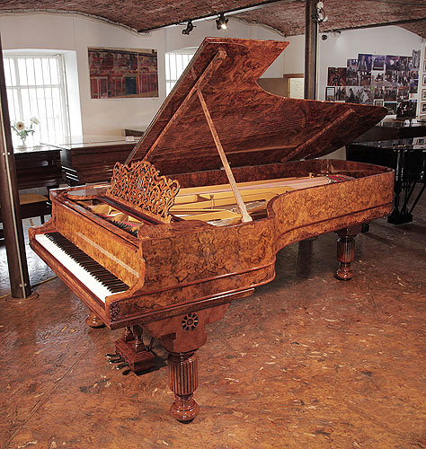 An 1881, Steinway & Sons Model D concert grand piano with a burr walnut case, filigree music desk and fluted, barrel legs