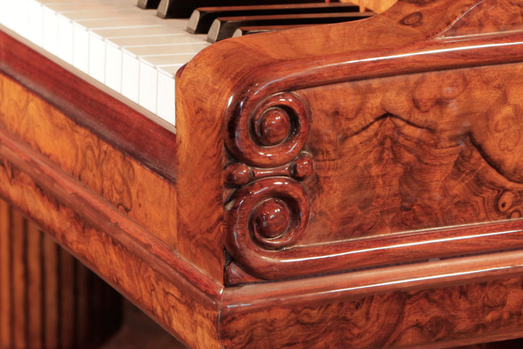 Carved, double curlicues on piano cheek