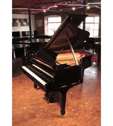 Rebuilt, 1932, Steinway Model M grand piano for sale with a black case and spade legs. Piano has an eighty-eight note keyboard and a two-pedal lyre. 