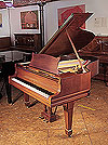 Piano for sale. Rebuilt, 1925, Steinway Model O grand piano for sale with a mahogany case and spade legs. Piano has an eighty-eight note keyboard and a two-pedal lyre. 