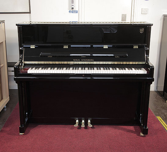 Brand New, Wilh. Steinberg Model AT-K23  upright Piano for sale with a black case.