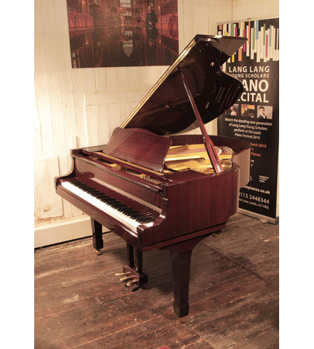 Reconditioned, 1992, Yamaha G1 baby grand piano with a mahogany case and spade legs