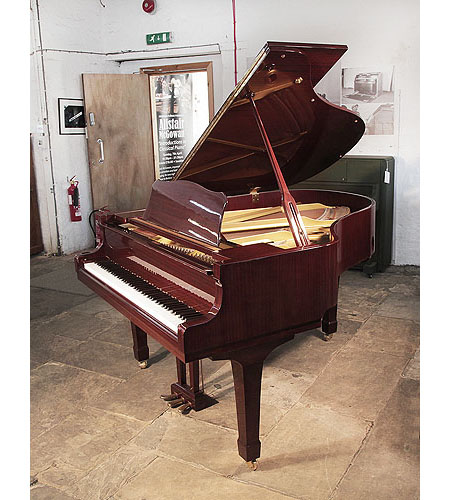 Reconditioned, 1993, Yamaha G2 grand piano with a mahogany case and spade legs. Piano has an eighty-eight note keyboard and a three-pedal lyre. 