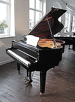  A 2009, Yamaha GB1 baby grand piano for sale with a black case and square, tapered legs