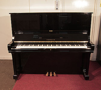  Reconditioned 1984, Yamaha U3 upright piano for sale with a black case and brass fittings. Piano has an eighty-eight note keyboard and three pedals