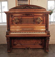German Late Renaissance style, Pfaffe upright piano for sale with a walnut case, mock roll top piano fall and barley twist legs