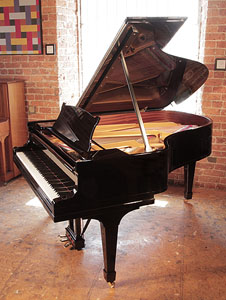 Rebuilt, 1928, Steinway Model A grand piano for sale with a black case and spade legs. Piano has an eighty-eight note keyboard and a three-pedal lyre. 
