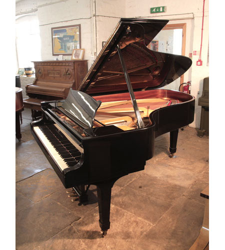 Reconditioned, 1975, Steinway Model B  grand piano for sale with a black case and spade legs. Piano has an eighty-eight note keyboard and a three-pedal lyre. 