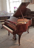 A 1937, Steinway Model S baby grand piano with a mahogany case and spade legs. Piano has an eighty-eight note keyboard and a two-pedal lyre.