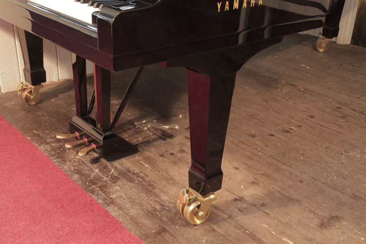 Yamaha CFIII  spade piano legs with dual casters.