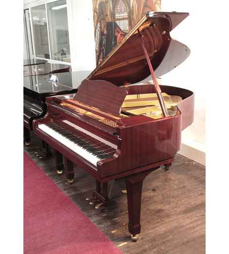 Reconditioned, 1989, Yamaha G1 baby grand piano with a mahogany case and spade legs. Piano has an eighty-eight note keyboard and a three-pedal lyre. 