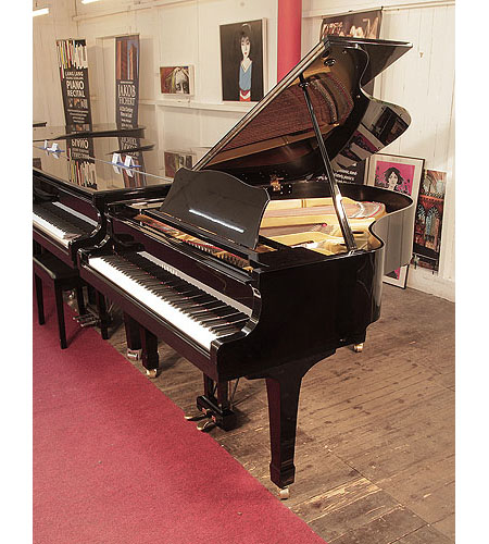 Reconditioned, 1978, Yamaha G2 grand piano for sale with a black case and spade legs. Piano has an eighty-eight note keyboard and a two-pedal lyre. 