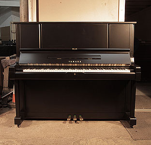 Reconditioned,  1981, Yamaha YUX upright piano for sale with a satin, black case and brass fittings