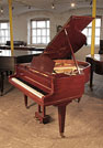 Piano for sale. A 1932, Bluthner baby grand piano for sale with a mahogany case and square, tapered legs Piano has an eighty-eight note keyboard and a three-pedal lyre.