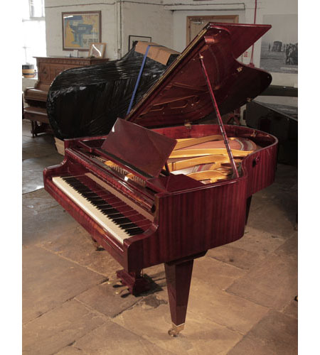 Restored, 1930's Bosendorfer grand piano for sale with a mahogany case and square, tapered legs. Piano has an eighty-eight note keyboard and a two-pedal lyre.