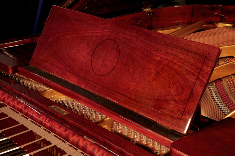 Bosendorfer  piano music desk with a central circular motif and rectangular border