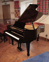 Reconditioned, 2001, Boston GP178 II grand piano for sale with a black case and spade legs. Piano has an eighty-eight note keyboard and a three-pedal lyre.