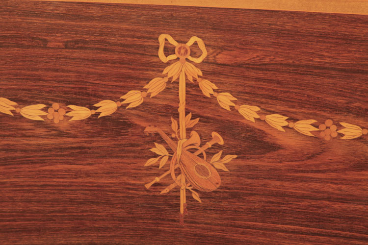 Broadwood cabinet inlay featuring swagged bellflowers tied with a bow and pendent musical instruments