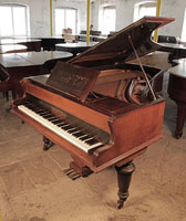 A 1900, Broadwood grand piano with a rosewood case and turned legs. Music desk features the makers name Broadwood in cut-out design. Piano has an eighty-eight note keyboard and a two-pedal lyre. 