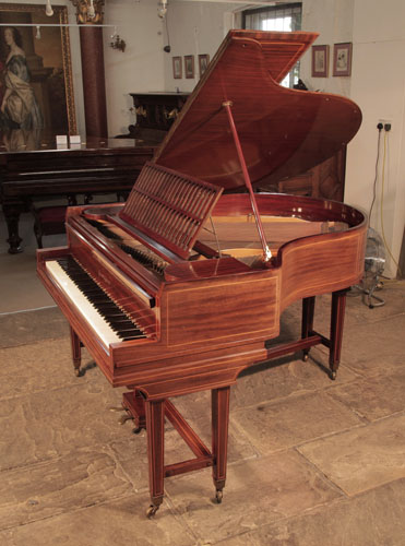 Piano for sale. A 1910, Collard and Collard baby grand piano with a mahogany case and gate legs attached with a cross stretcher. Cabinet inlaid with satinwood stringing accents