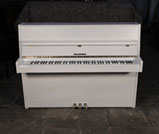 Piano for sale. Pre-owned, 1979, Fazer upright piano with a matt, white case and brass fittings. Piano has an eighty-eight note keyboard and three pedals.