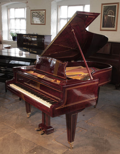 Restored, 1910, Grotrian Steinweg grand piano for sale with a mahogany case and satinwood stringing accents. Piano has square tapered legs. Piano has an eighty-eight note keyboard and a two-pedal lyre. 