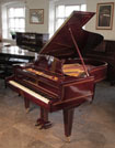 Piano for sale. Restored, Grotrian Steinberg grand piano for sale with a mahogany case and satinwood stringing accents. Piano has an eighty-eight note keyboard and a two-pedal lyre.