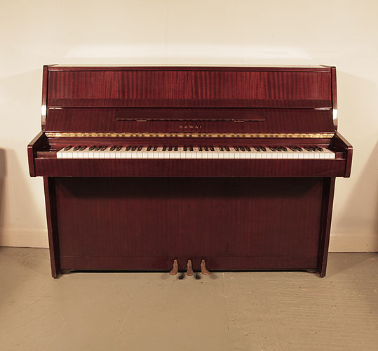 A 1982, Kawai CE7N upright piano for sale with a mahogany case and brass fittings