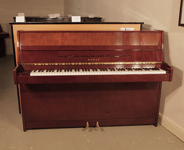 Reconditioned, 1985, Kawai CX-4S Upright Piano For Sale with a Walnut Case and Brass Fittings