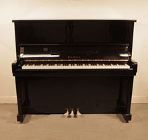 Piano for sale. Reconditioned, 1964, Kawai K20 upright piano with a black case and polyester finish. Piano has an eighty-eight note keyboard and three pedals.  