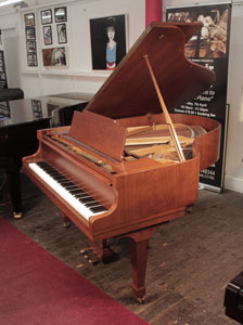  Reconditioned, 1978, Kawai KG-2C grand piano for sale with a polished, walnut case and spade legs