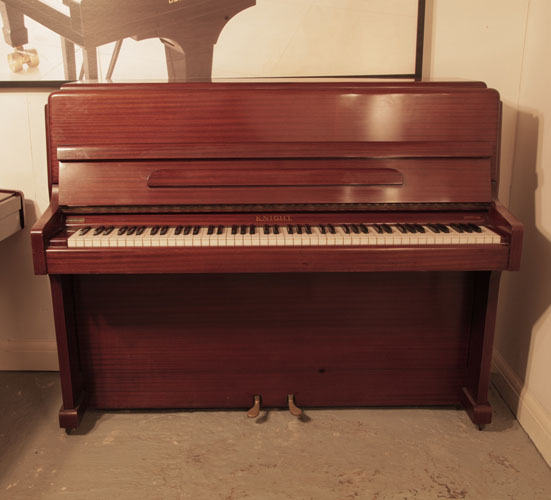 A 1963, Knight upright piano for sale with a polished, mahogany case and brass fittings. Piano has an eighty-eight note keyboard and and two pedals. 