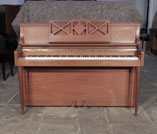 Piano for sale. Pre-owned, 1970, Knight upright piano with a mahogany case and cut-out music desk. Piano has an eighty-eight note keyboard and two pedals. 