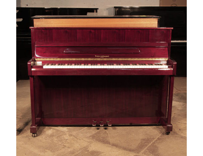 Pre-owned, Kohler and Campbell KC-112 upright piano for sale with a mahogany case and brass fittings.. Piano has an eighty-eight note keyboard and three pedals. 