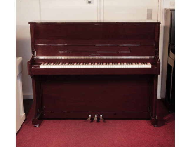  A 2016, Ritmuller EU118 upright piano for sale with a mahogany case and slow fall mechanism. Condition as new. Piano has an eighty-eight note keyboard and and three pedals