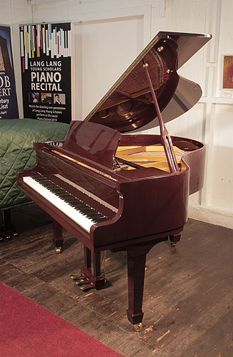A 2014, Steinbach baby grand piano for sale with a mahogany case and spade legs