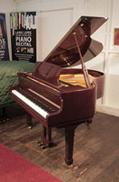 Compact, 2014, Steinbach baby grand piano for sale with a mahogany case and spade legs. 