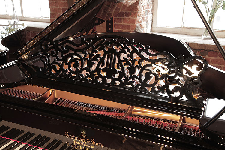 Steinway Model A openwork music desk in an arabesque design with central lyre motif. We are looking for Steinway pianos any age or condition.