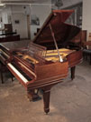 Piano for sale. Antique, 1900, Steinway Model A grand piano with a polished, rosewood case and spade legs. The cut-out music desk is in a geometric design featuring interlocking ovals.